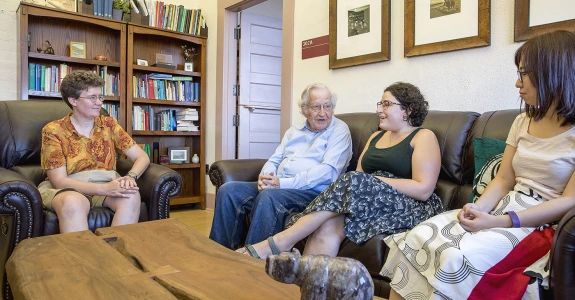 Noam Chomsky speaking with Linguistics department members.