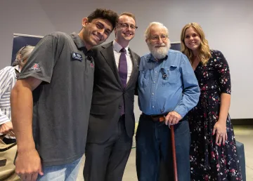 Noam Chomsky with three undergraduate students